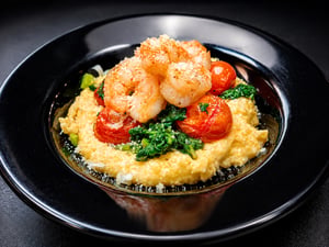 Shrimp with creamy polenta, roasted tomatoes and greens